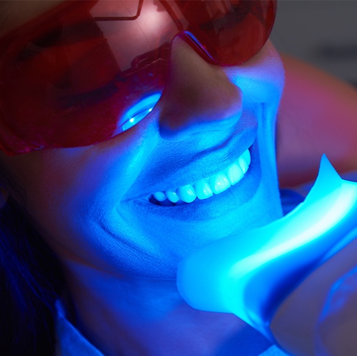 Woman receiving in office teeth whitening