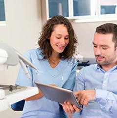 A dentist explaining treatment to her patient