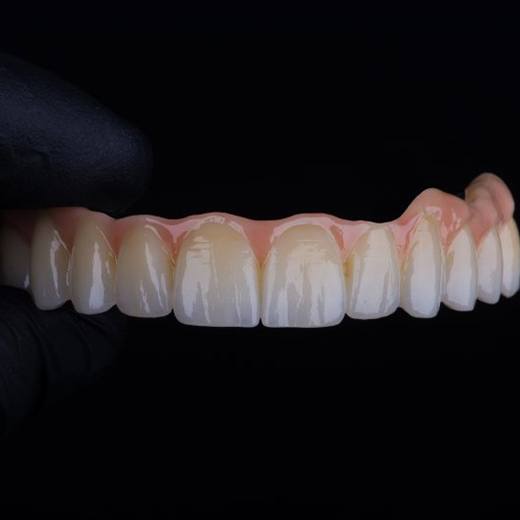 Close up of digital dentures on black background