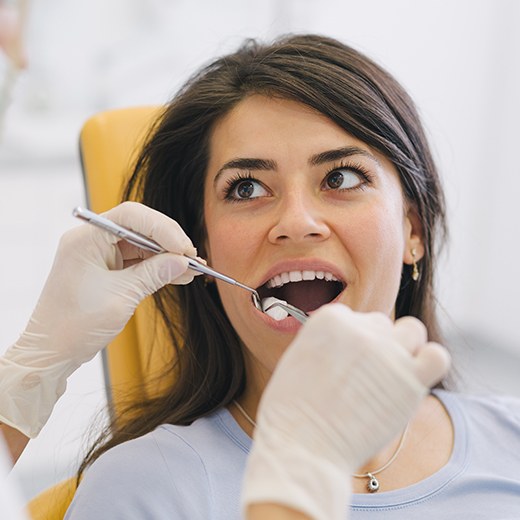 Patient receiving a simple tooth extraction
