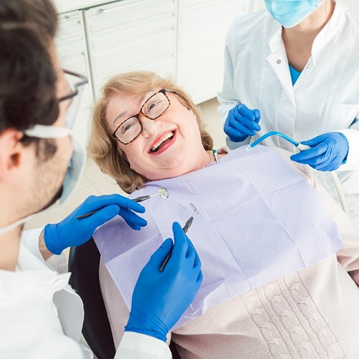 Smiling woman preparing for a tooth extraction