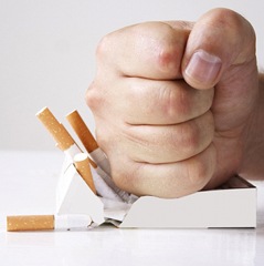 Man crushing cigarettes