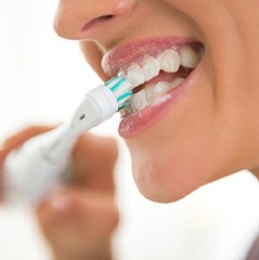 Woman brushing teeth