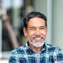 Man smiling with dental implant in Cleveland