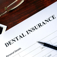 a dental insurance form next to an xray image