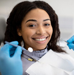 a patient smiling during a dental checkup