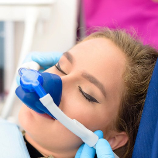 Woman with nasal mask for nitrous oxide sedation in Cleveland, TX