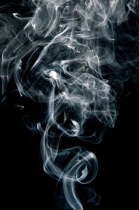 Cigarette smoke on black background