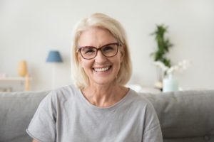 Older woman with dental implants smiling