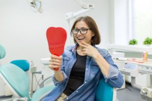 young woman smiling with dental implants